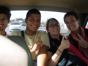 ...no problem! Four in the back and two in the front (plus driver) is perfectly acceptable!